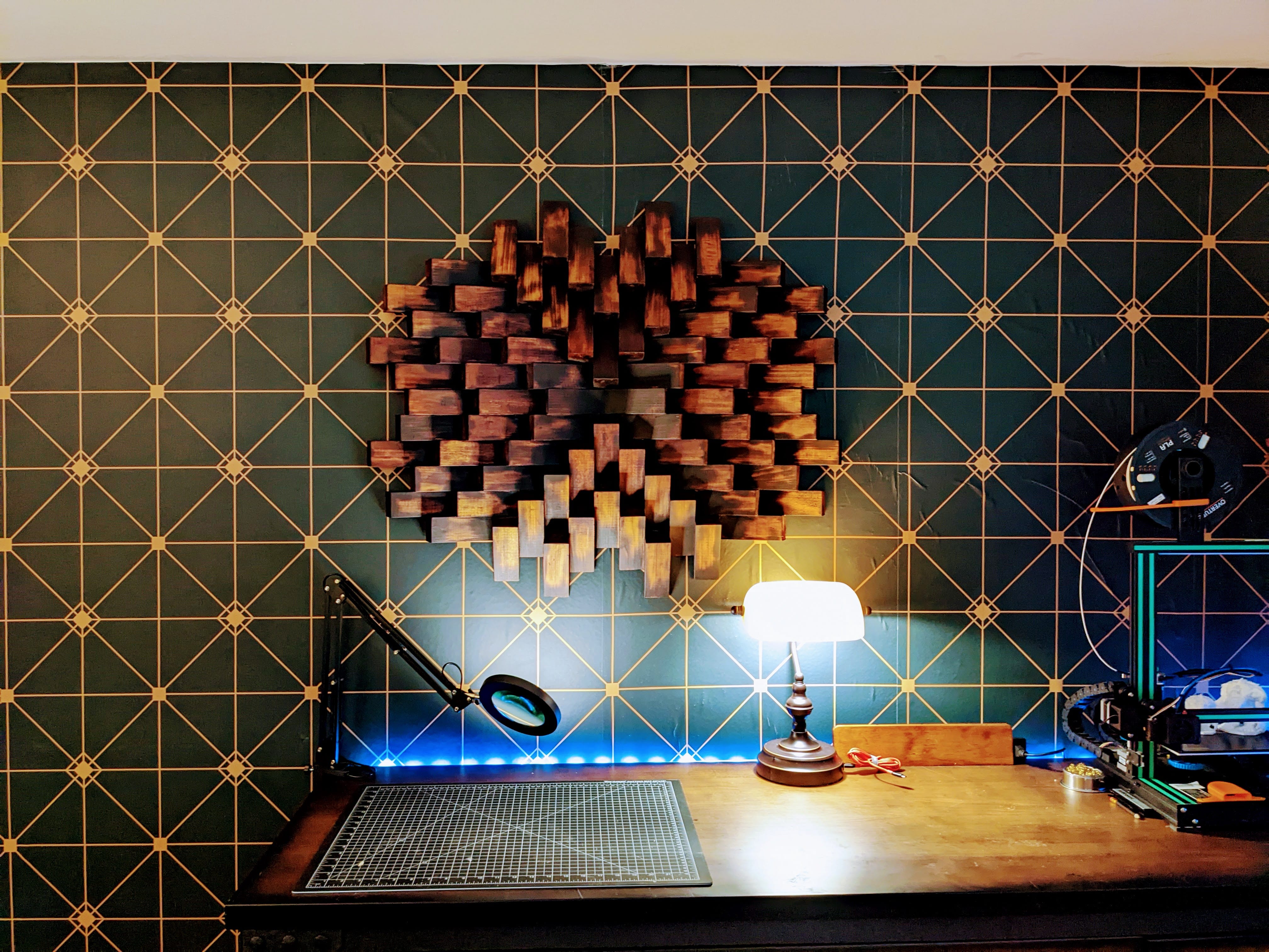 A closer view of the finished four-foot diffuser installed above the workbench, with its staggered blocks projecting from the wall.