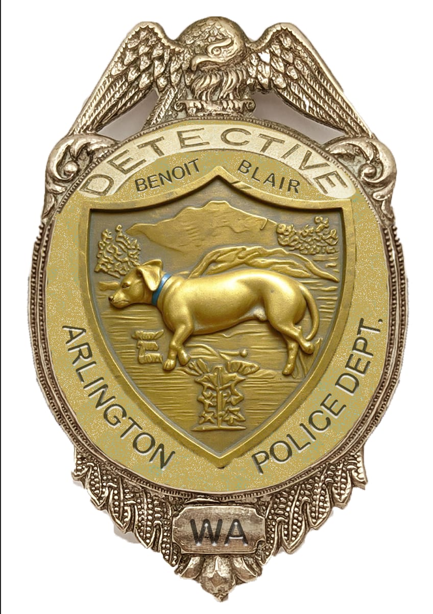 A rough Photoshop badge composite with a dog in the center, Detective Benoit Blair above it, and Arlington Police Dept. around the border.