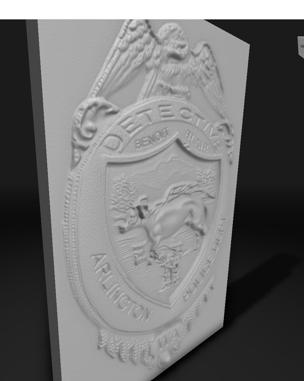 A gray 3D relief model of the detective badge, showing the dog, eagle, and lettering.