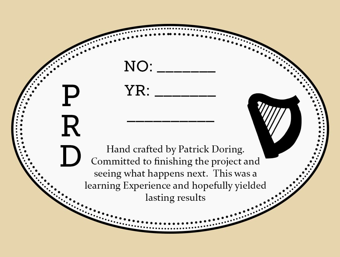 The hand lettered interior label, with the initials PRD, a mandolin outline, and blank lines for a serial number and a year.
