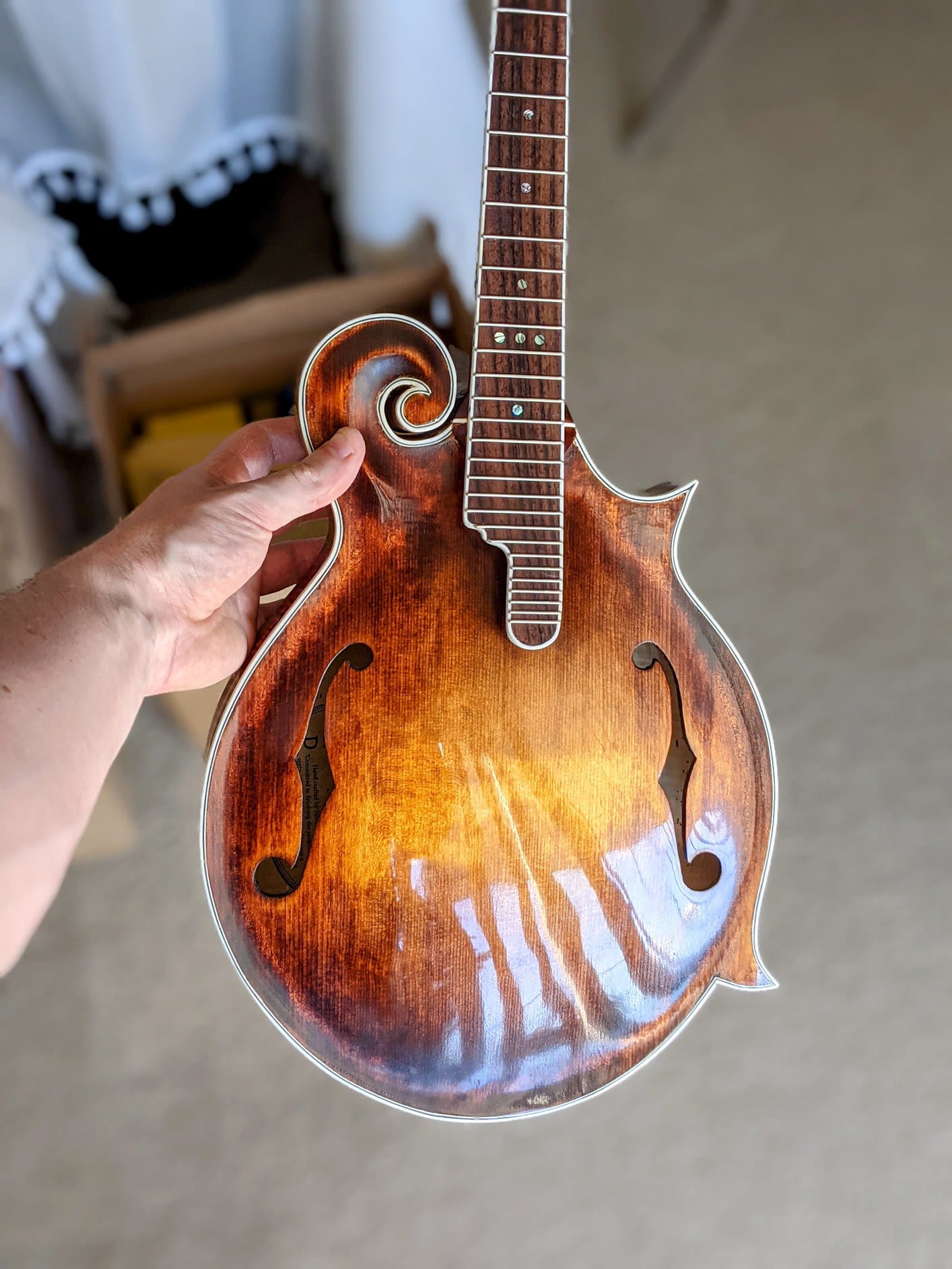The buffed front reflecting a window, the orange peel sanded out and the finish levelled.