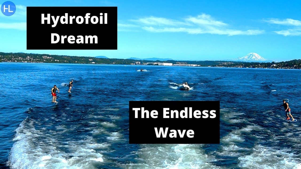 The video's title card: foilers riding a boat wake on open water with a snow capped peak on the horizon, captioned Hydrofoil Dream, The Endless Wave.